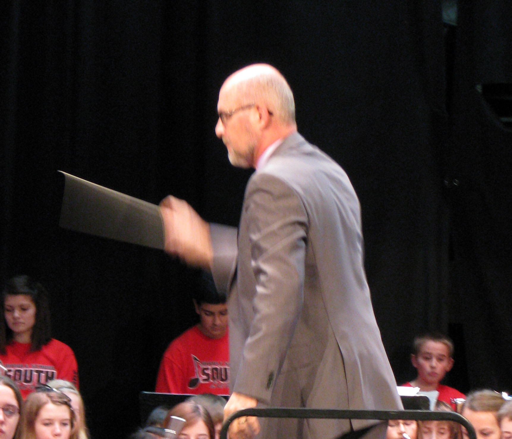 Photo of Bill Simon conducting middle school band